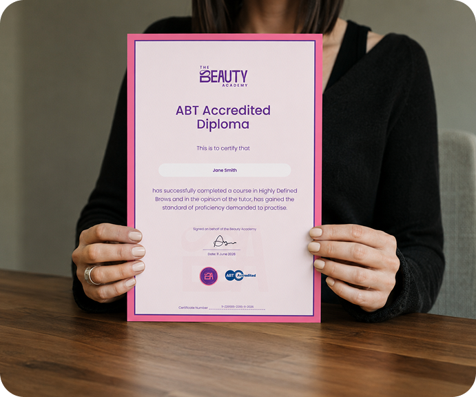 Student holding her Beauty Academy diploma certificate